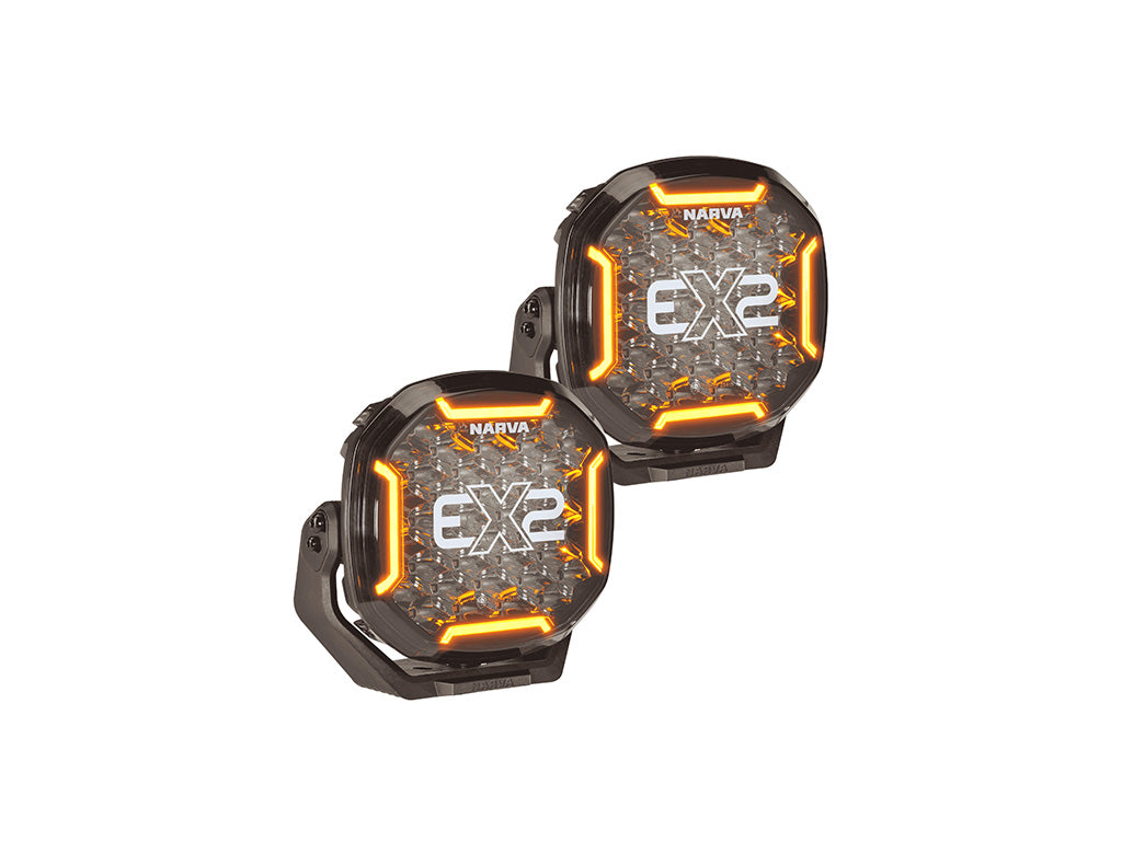 Two NARVA EX2 LED light units with black housings and illuminated orange accent rings, shown on a plain white background.
